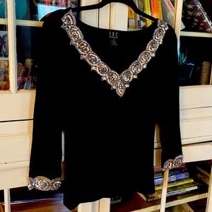 Size M black INC sweater with sequin trim.
